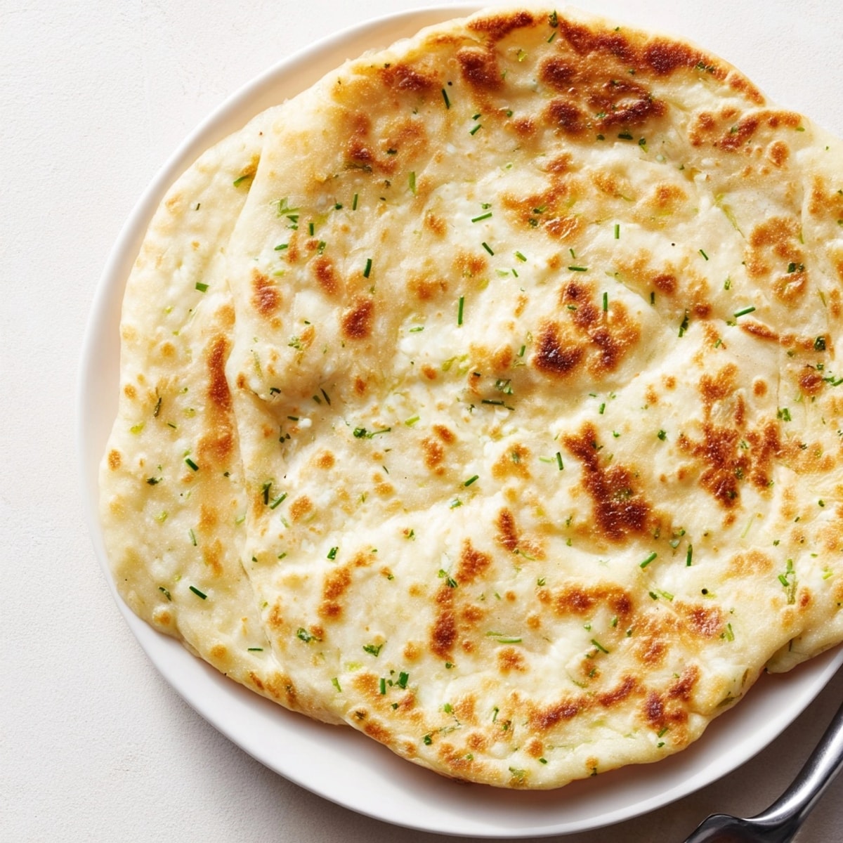 Warm, golden Cottage Cheese Flatbread Wrap; enjoy this easy, high-protein bread with savory toppings.