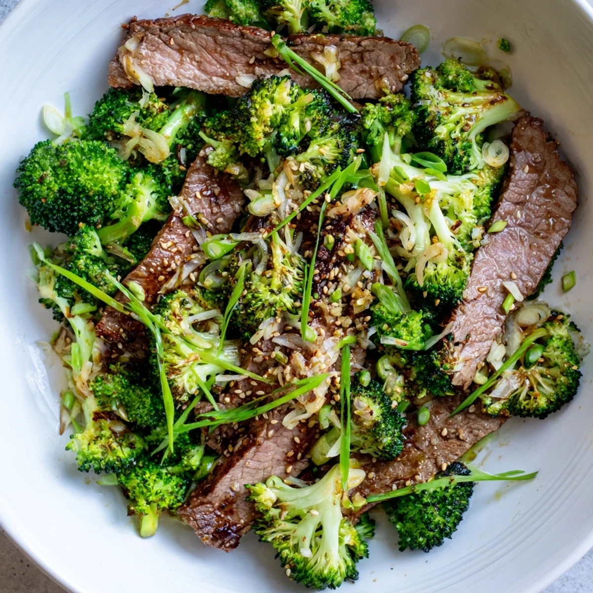 Tender slices of flank steak and bright green broccoli wok-tossed with minced garlic and fresh ginger in Keto Friendly Beef and Broccoli Stir Fry with Ginger.