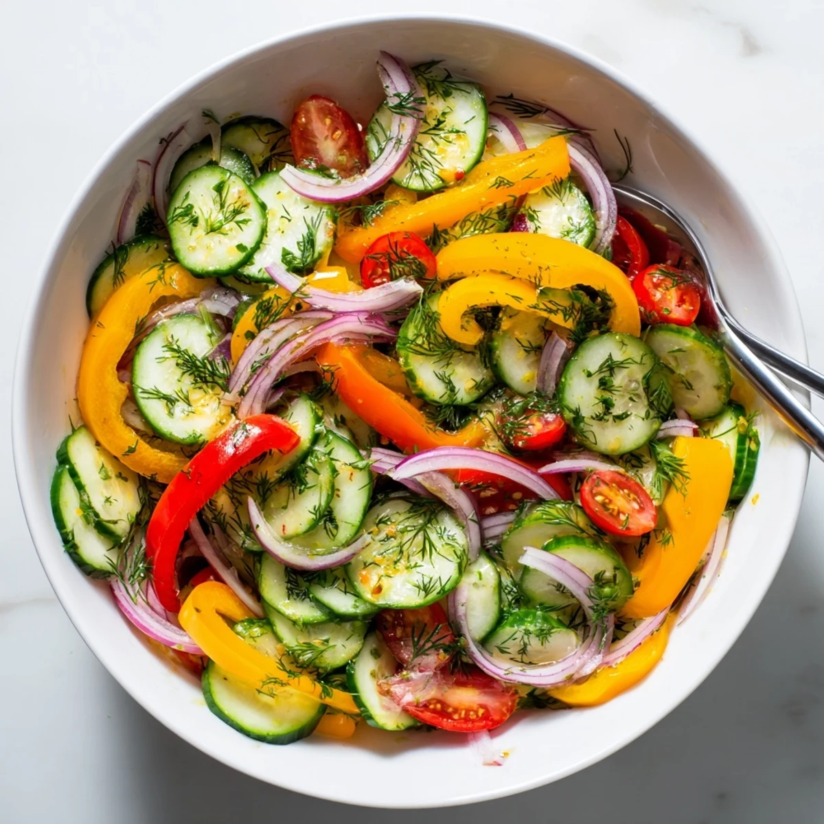 Fresh cucumber and sweet pepper salad with vibrant vegetables in a light herb dressing bowl