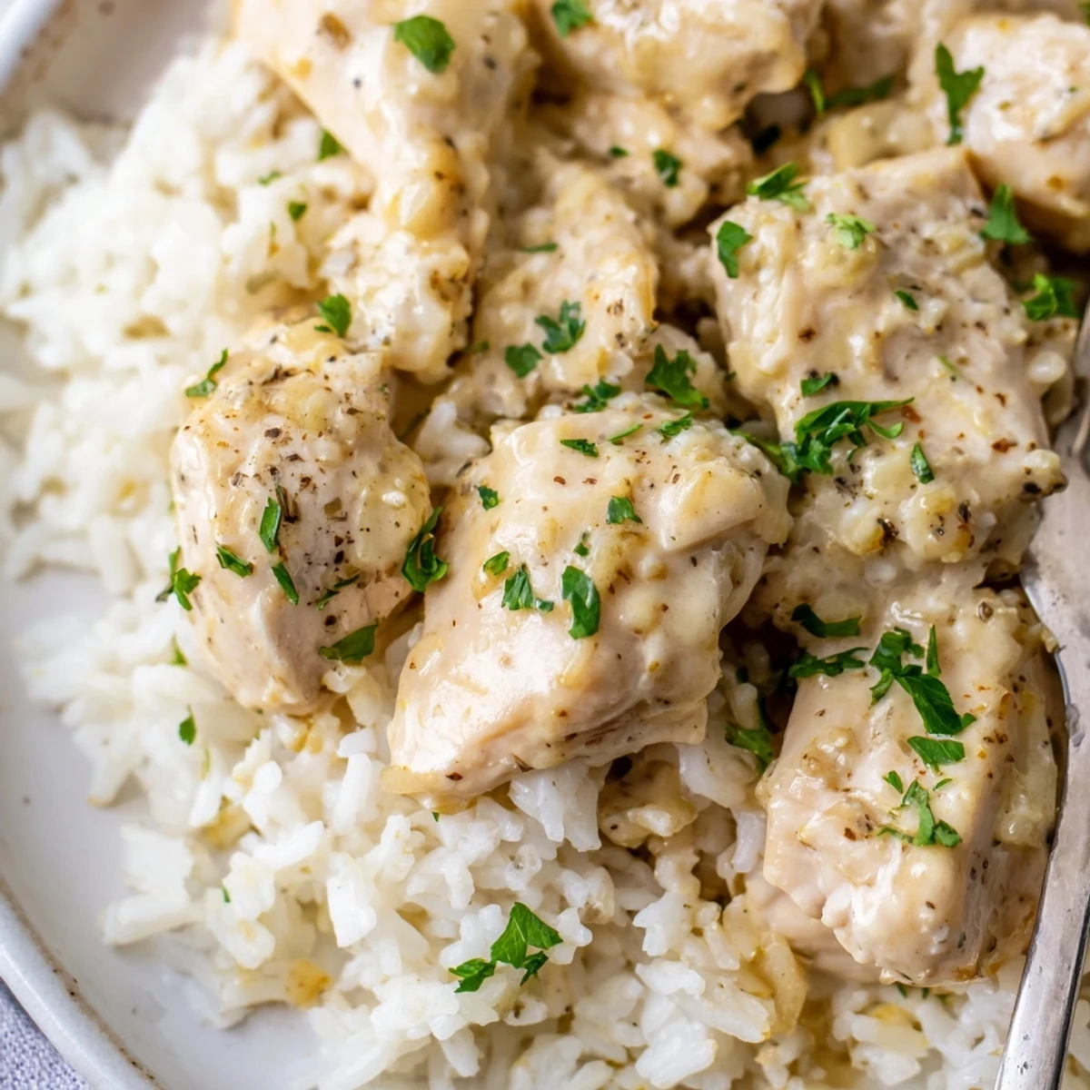 Savory angel chicken rice bake featuring golden brown chicken breasts nestled in tender white rice