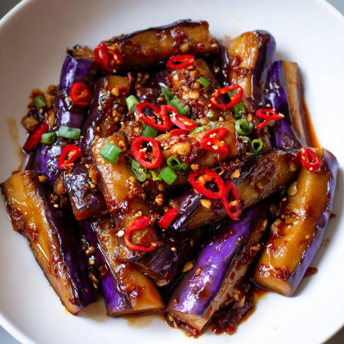 Smoky, tender Sichuan Style Braised Aubergines coated in glossy chili-broad bean paste