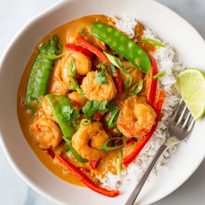 Imagine a vibrant bowl of Coconut Curry Shrimp aromatic steaming and ready to devour.