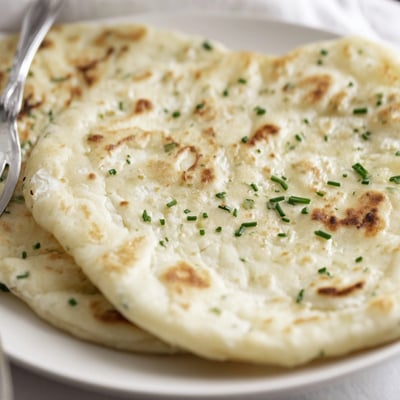 Homemade Cottage Cheese Flatbread Wrap showing soft texture, ideal for lunch with favorite ingredients.